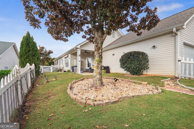 view of yard with a patio and ceiling fan