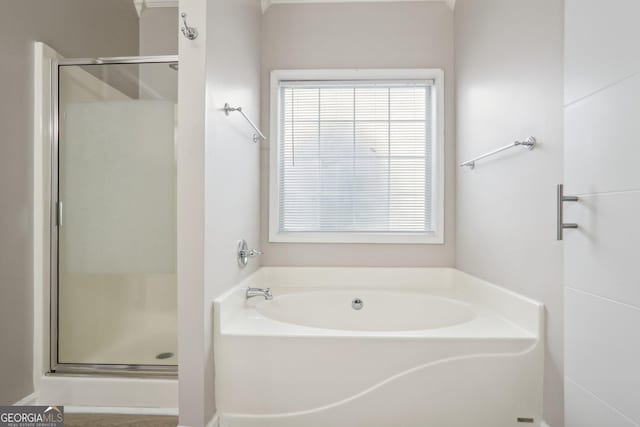 bathroom with separate shower and tub