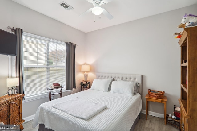 bedroom featuring light wood-type flooring and ceiling fan