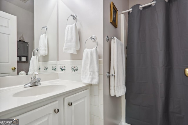 bathroom featuring vanity and a shower with shower curtain