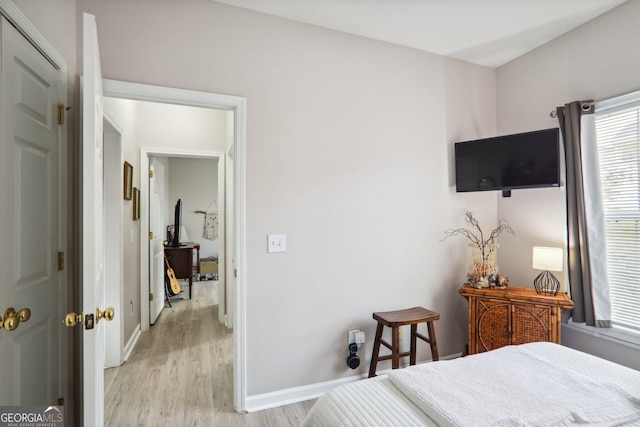 bedroom with light hardwood / wood-style floors