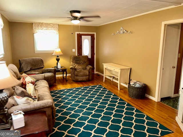 living room with ornamental molding, hardwood / wood-style floors, and ceiling fan