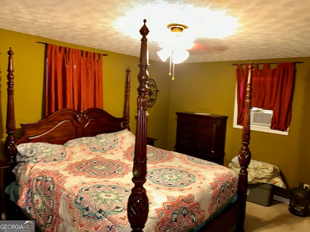 carpeted bedroom featuring a textured ceiling