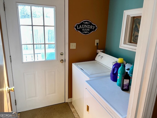 laundry area featuring washing machine and clothes dryer