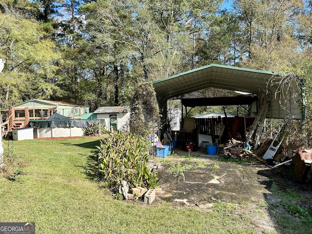 view of yard with a carport