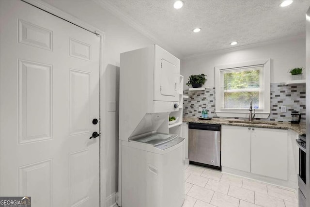 kitchen featuring stainless steel appliances, white cabinets, sink, and decorative backsplash