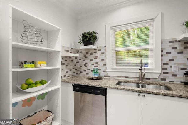 kitchen featuring stainless steel dishwasher, sink, light stone countertops, and white cabinets