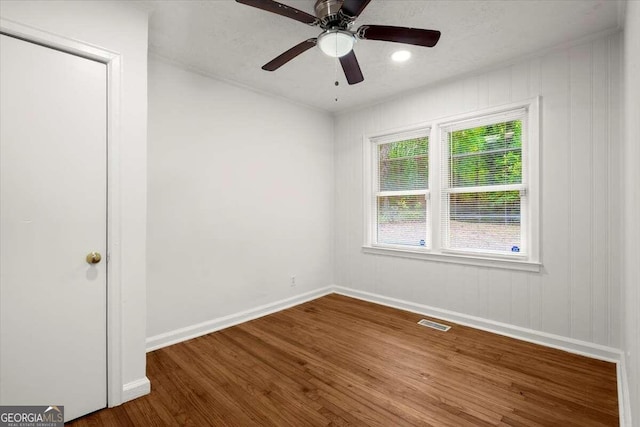 unfurnished room featuring hardwood / wood-style floors and ceiling fan