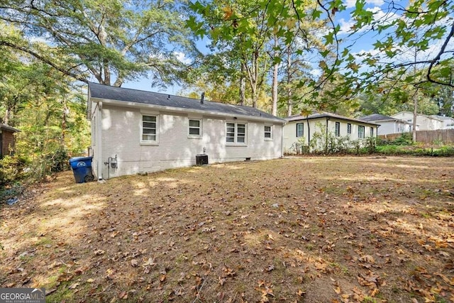 rear view of house with cooling unit