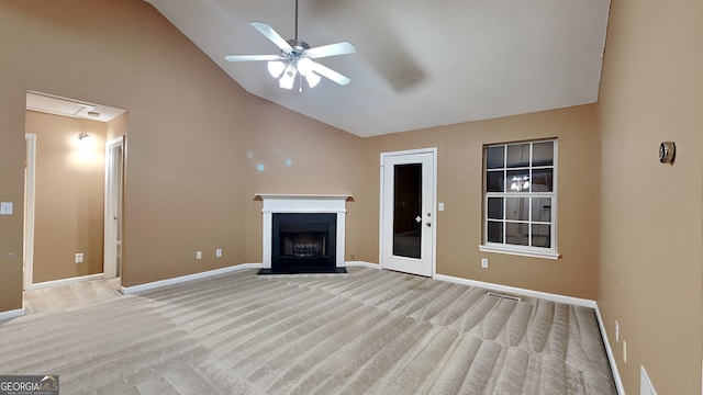 unfurnished living room with ceiling fan, light carpet, and high vaulted ceiling