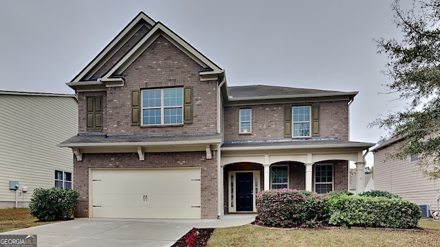 craftsman house featuring a garage and central AC