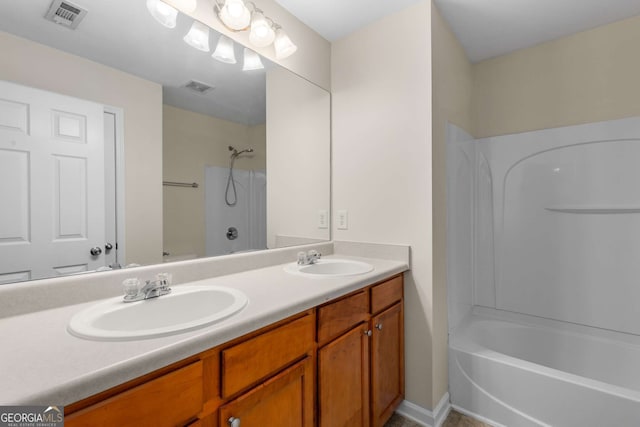 bathroom with vanity and shower / bathing tub combination