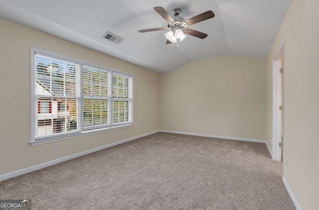 unfurnished room with vaulted ceiling, light carpet, and ceiling fan