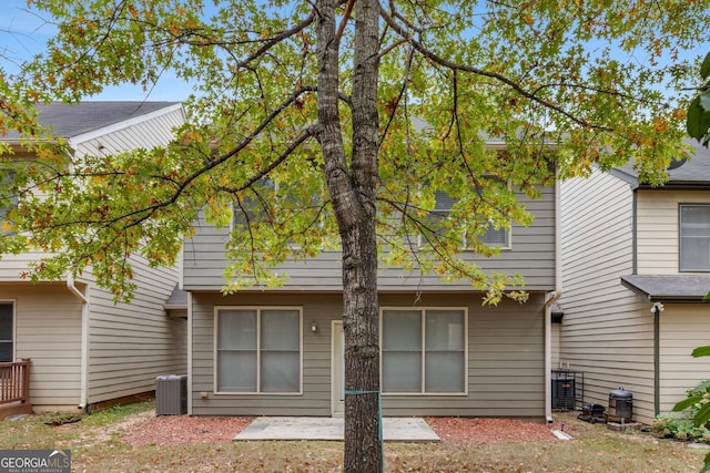 back of property featuring central AC and a patio