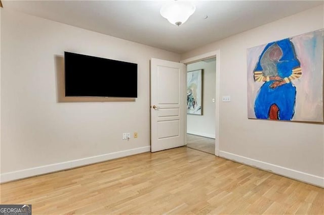 unfurnished room featuring hardwood / wood-style floors