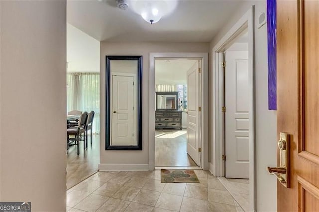 hallway with light tile patterned flooring