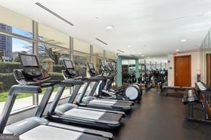 gym with a wall of windows