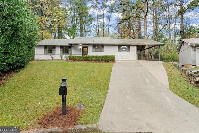 single story home featuring a carport and a front yard