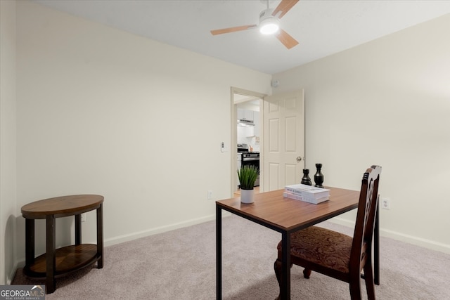 office area featuring ceiling fan and light colored carpet