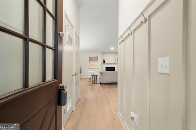 hallway with light wood-type flooring