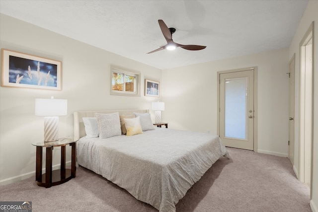 bedroom featuring ceiling fan and light carpet