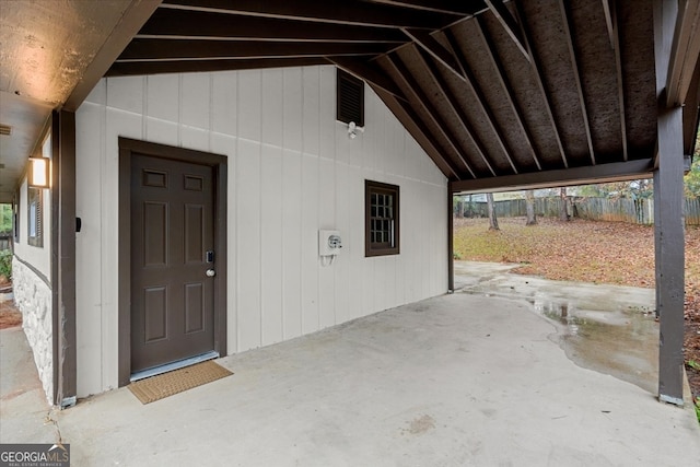 view of exterior entry featuring a patio