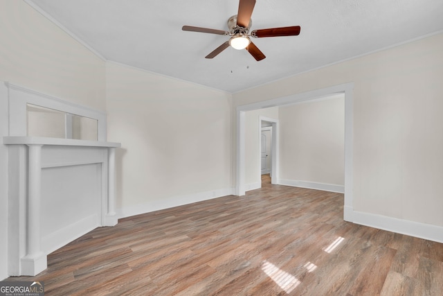 empty room featuring hardwood / wood-style floors, ceiling fan, and crown molding