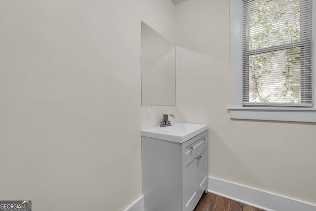 bathroom featuring hardwood / wood-style floors and vanity