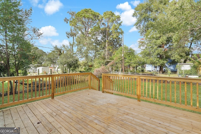 deck featuring a lawn