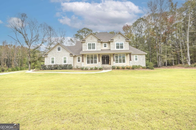 craftsman-style home with a front yard and a porch