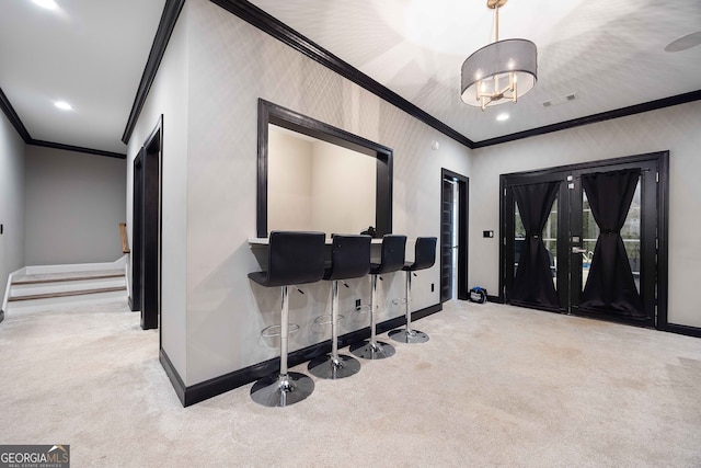 interior space featuring light colored carpet and crown molding