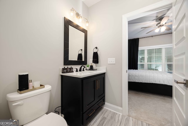 bathroom with vanity, ceiling fan, and toilet