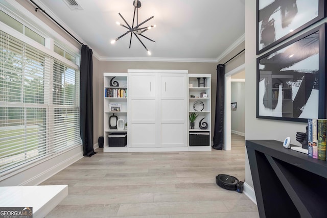 living area with light hardwood / wood-style flooring, crown molding, and plenty of natural light