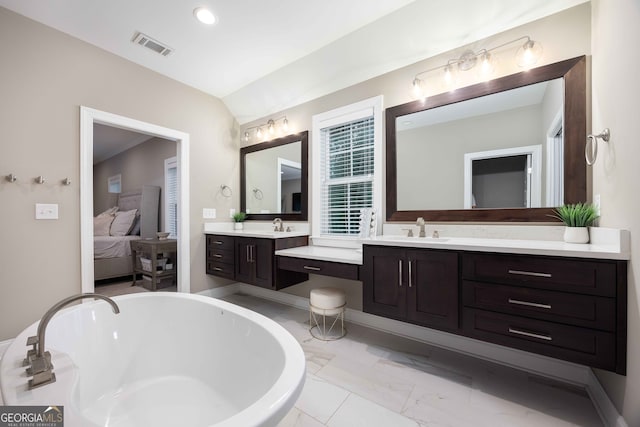 bathroom featuring vanity and a bathing tub