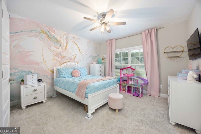 bedroom with ceiling fan and light carpet