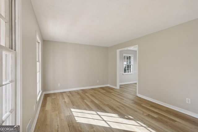 unfurnished room featuring light hardwood / wood-style floors