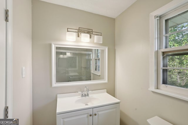 bathroom with vanity and a textured ceiling