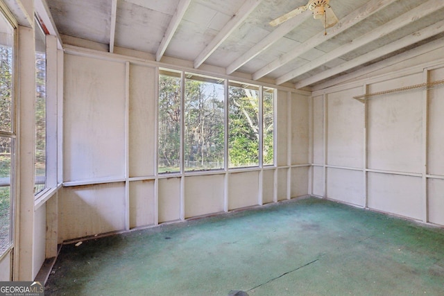 unfurnished sunroom featuring ceiling fan