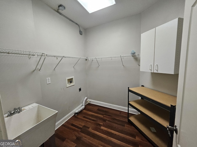 laundry area with cabinets, washer hookup, electric dryer hookup, dark wood-type flooring, and sink