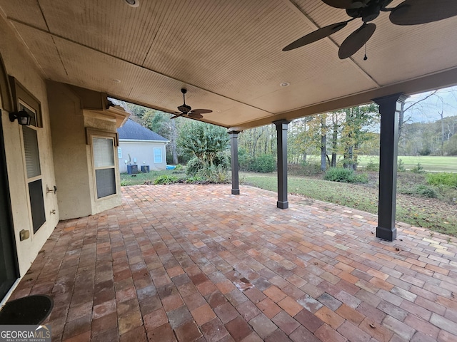 view of patio / terrace with central AC unit and ceiling fan