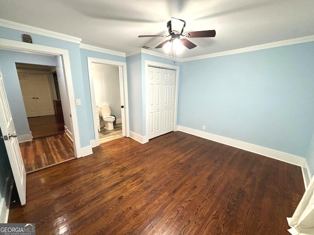 unfurnished bedroom with dark wood-type flooring, ornamental molding, a closet, and ceiling fan