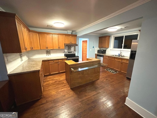 kitchen with sink, dark hardwood / wood-style flooring, decorative backsplash, ornamental molding, and stainless steel appliances