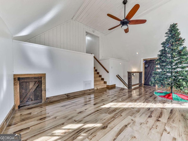 living room featuring high vaulted ceiling, light wood-type flooring, wood ceiling, and ceiling fan