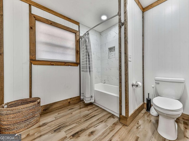 bathroom with toilet, wood walls, wood-type flooring, and shower / bathtub combination with curtain