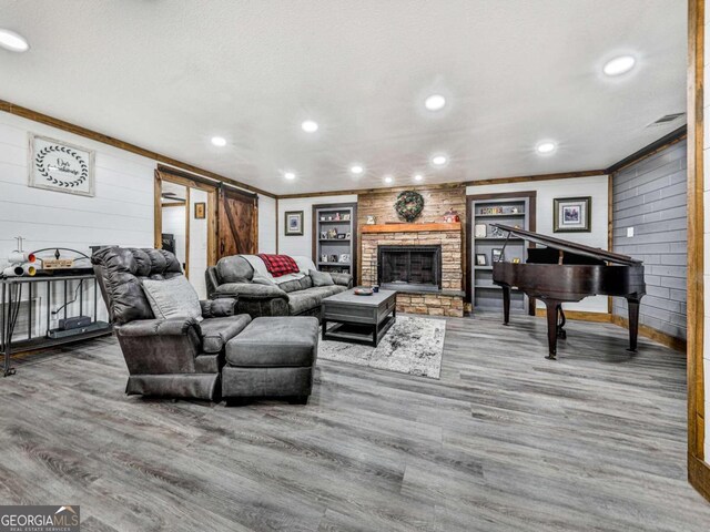 231 Tipton Trl Lot 1, Morganton, GA 30560 - living area with ornamental molding, wood finished floors, wood walls, a large fireplace, and recessed lighting