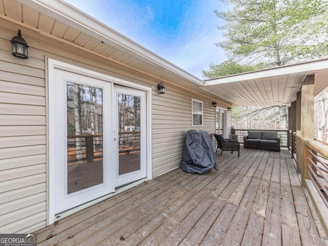 wooden terrace featuring area for grilling