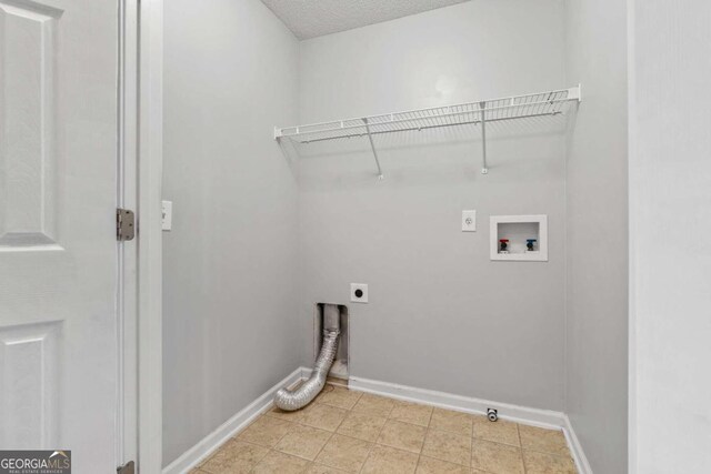 2357 Bayrose Cir Unit 57B, Atlanta, GA 30344 - laundry area with hookup for a washing machine, electric dryer hookup, and a textured ceiling