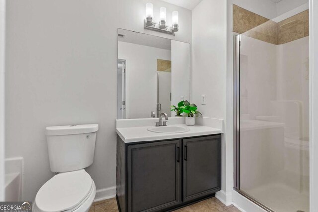 2357 Bayrose Cir Unit 57B, Atlanta, GA 30344 - bathroom featuring walk in shower, tile patterned flooring, vanity, and toilet