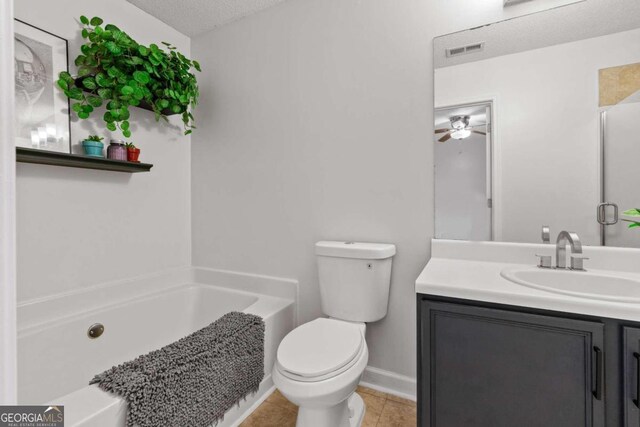 2357 Bayrose Cir Unit 57B, Atlanta, GA 30344 - bathroom featuring tile patterned floors, vanity, a textured ceiling, toilet, and ceiling fan