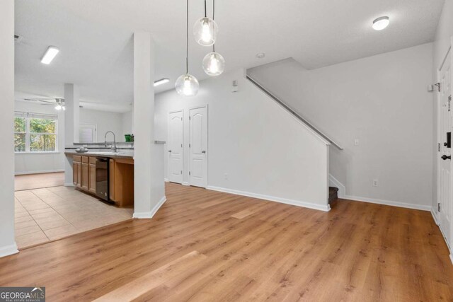 2357 Bayrose Cir Unit 57B, Atlanta, GA 30344 - kitchen featuring pendant lighting, ceiling fan, and light hardwood / wood-style flooring